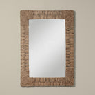 Folha Rectangular Mirror in Natural on a beige background at Addison West