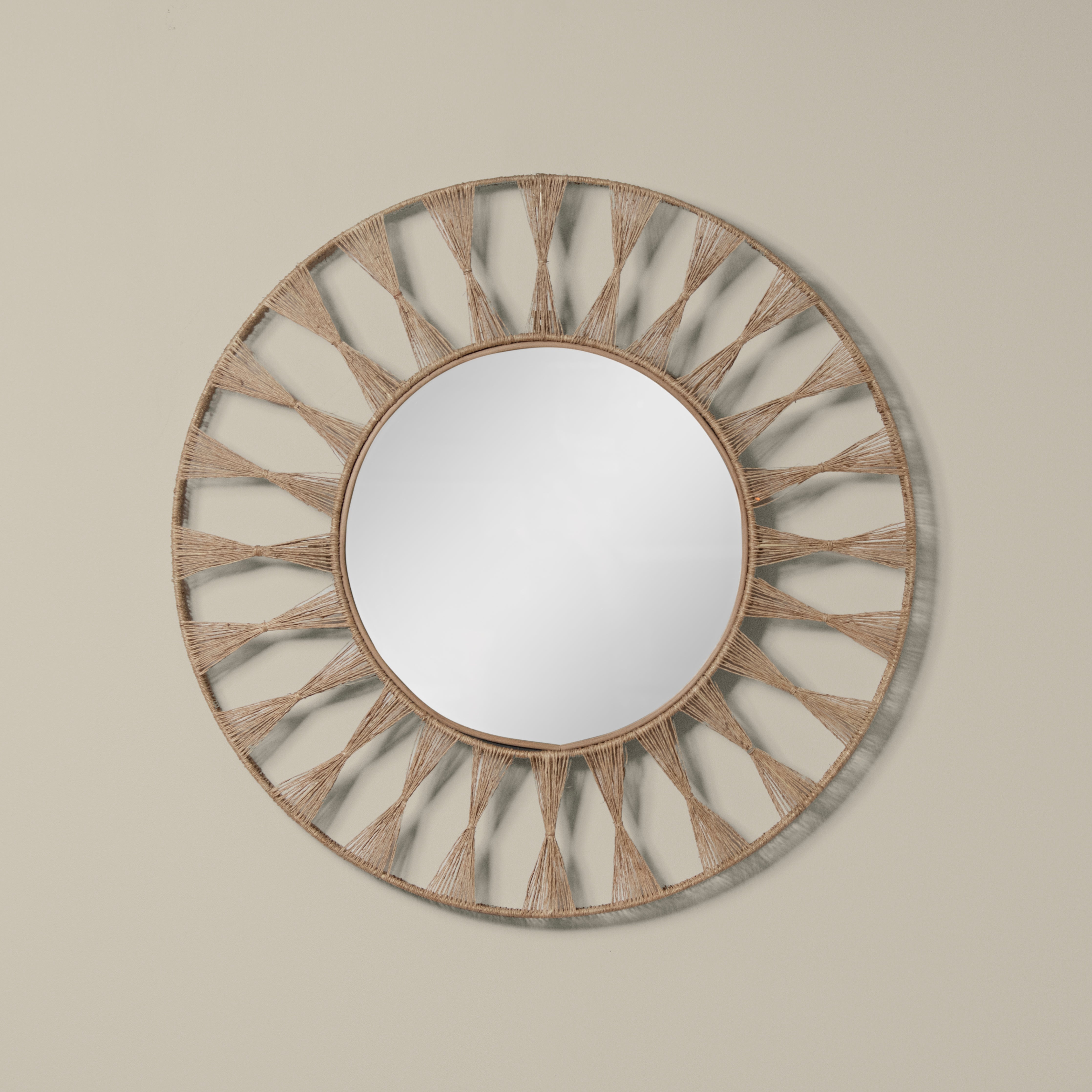 Ojai Round Mirror on a beige background at Addison West