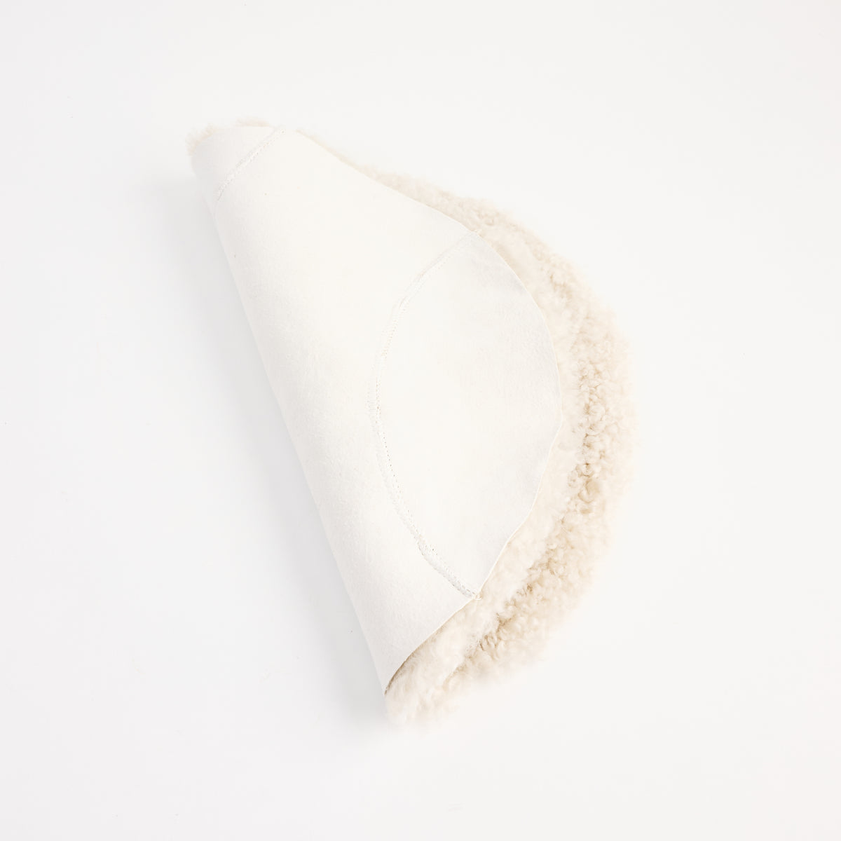 Short Wool Curly Sheepskin Seat Cover on a white background at Addison West