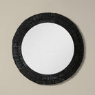 Folha Round Mirror in Black on a beige background at Addison West