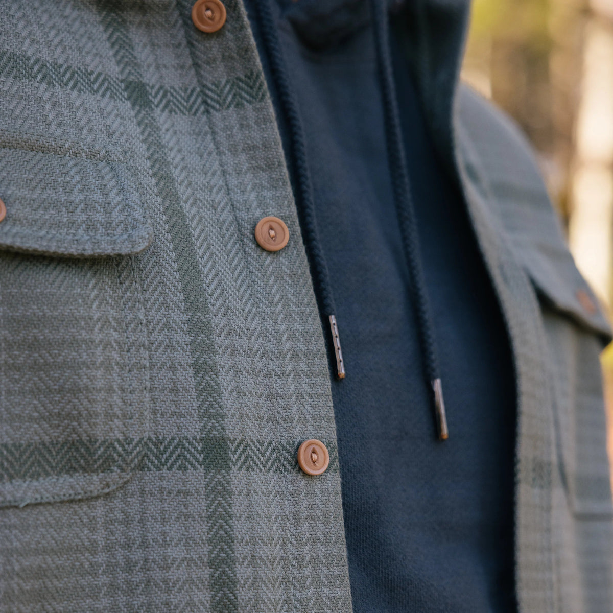 Warren Six Season Flannel in Lichen on a model at Addison West