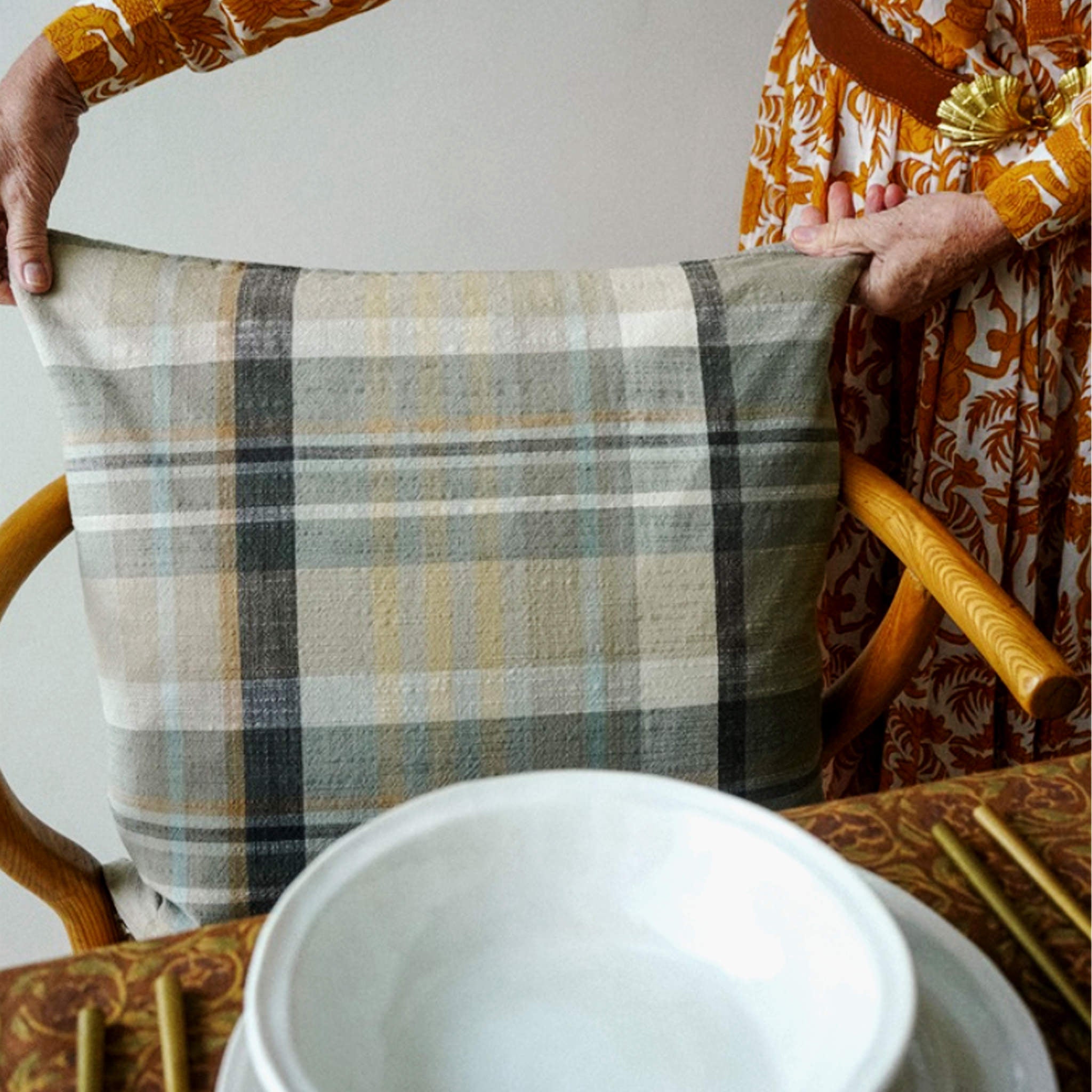 Delacourt Pillow, 20x20 on a dining chair at Addison West