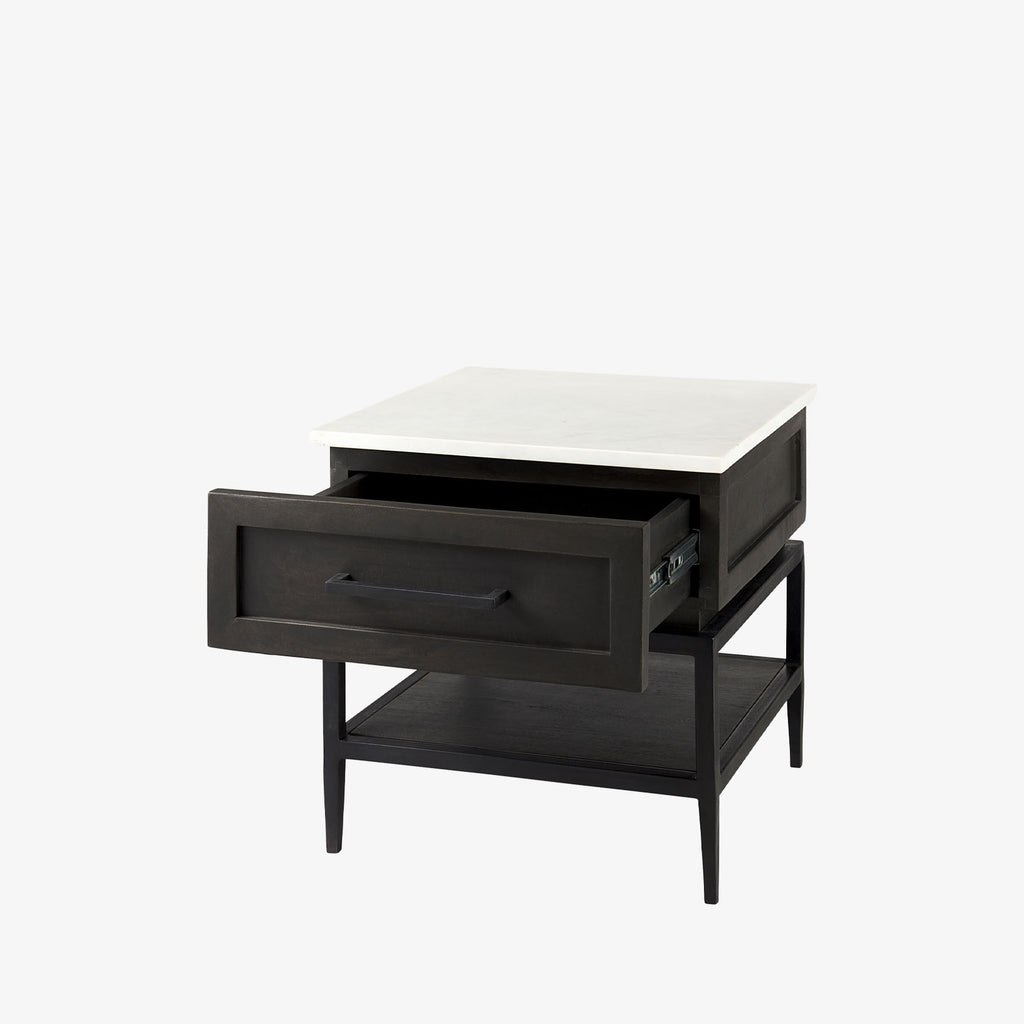Square end table with black iron base, wood shelf and drawer and marble top on a white background