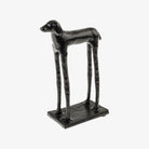 Black dog-shaped object on a white background