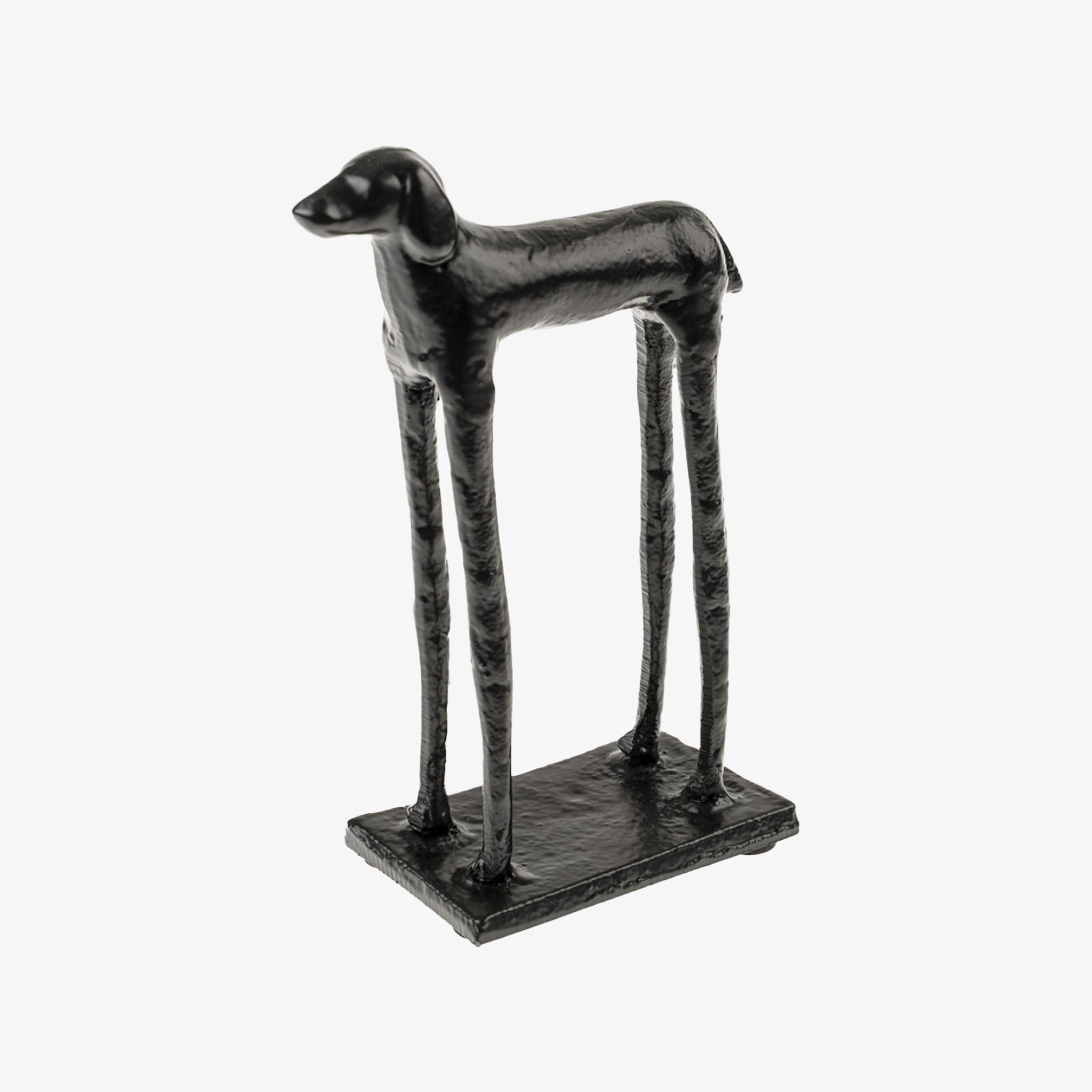 Black dog-shaped object on a white background