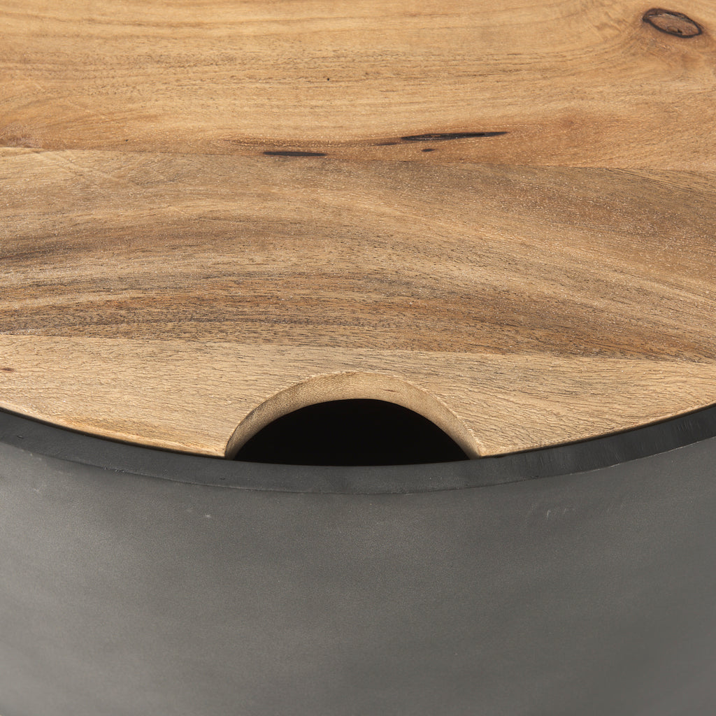 Close up of wood top and gunmetal sides of drum nesting coffee tables.
