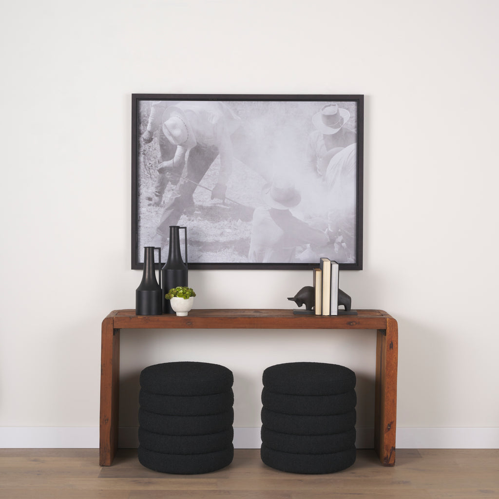 Elise Black Boucle Upholstered Storage Ottoman in a hallway