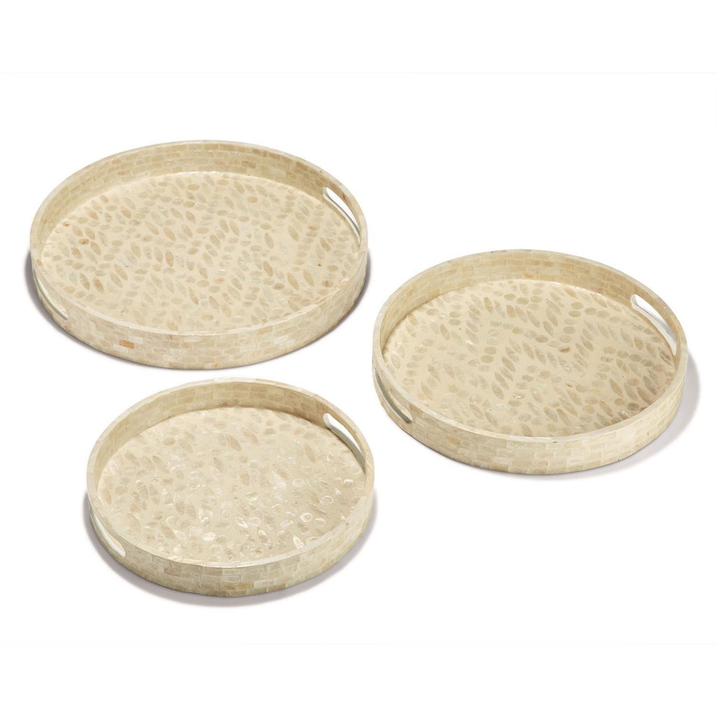 Three round creme bone inlay trays on a white background