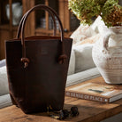 Elsie Leather Tote in Antique Brown on a table at Addison West