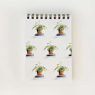 Notebook with potted plant design on a white background