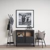 Everett Matte Black Metal with Two Metal Shelves Coat Rack in a monochromatic black and white entry way