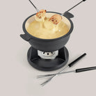 Swissmar Lucerne Cast Iron Fondue Set in Matte Black on a white background at Addison West