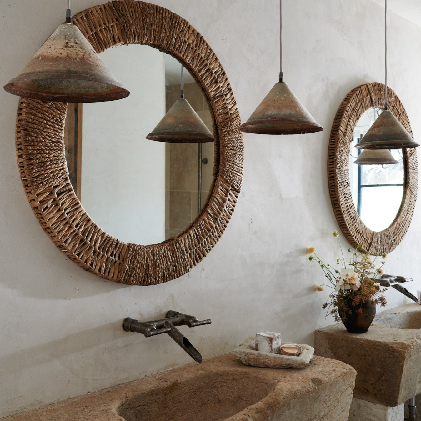 Folha Round Mirror in Natural in a bathroom at Addison West