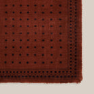 Moismont Scarf Achille N°851 in Violin on a model at Addison West on a beige background at Addison West