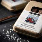 Farmhouse Chocolates Milk Chocolate Salted Caramel 4 Piece Box on a black background at Addison West