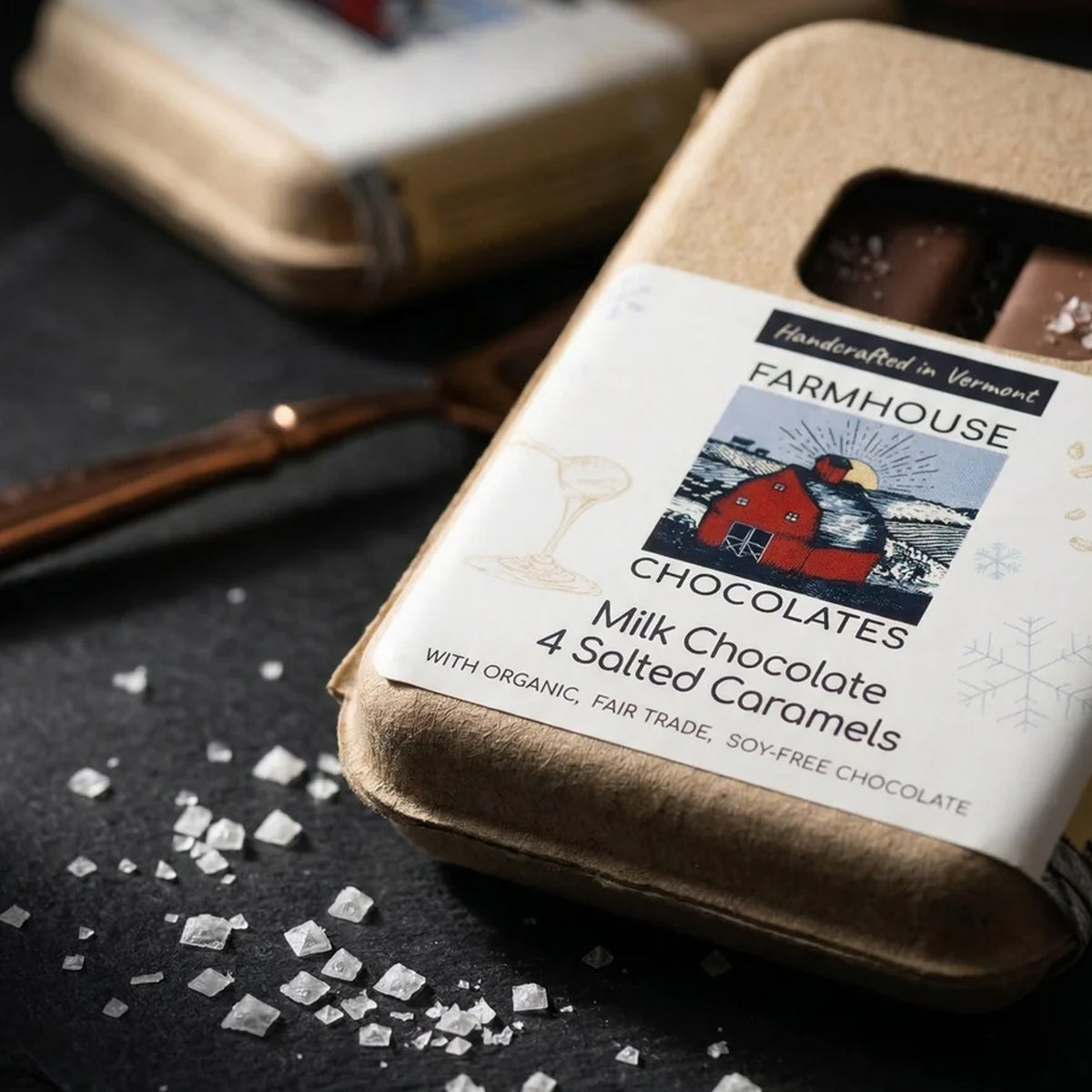 Farmhouse Chocolates Milk Chocolate Salted Caramel 4 Piece Box on a black background at Addison West