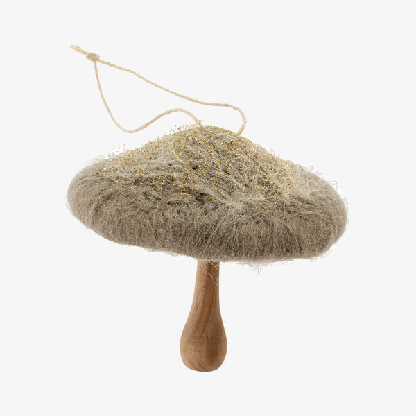 Grey green felted mushroom ornament with wood stem on a white background