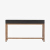 Four Hands Fiona Desk in Black Raffia with brass legs on a white background