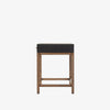 Four Hands Fiona Desk in Black Raffia with brass legs on a white background