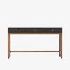 Four Hands Fiona Desk in Black Raffia with brass legs on a white background