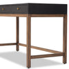 Four Hands Fiona Desk in Black Raffia with brass legs on a white background