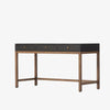Four Hands Fiona Desk in Black Raffia with brass legs on a white background