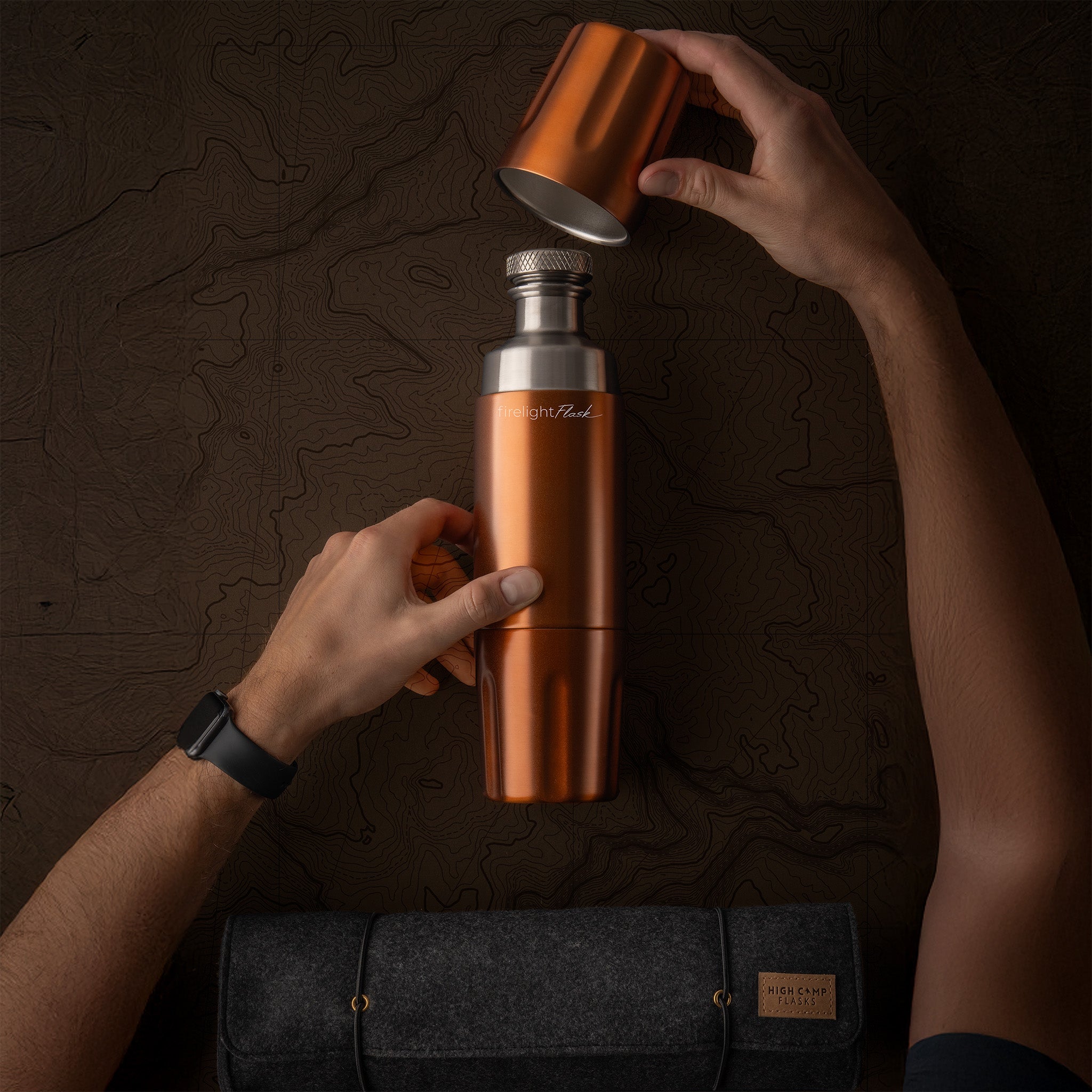 High Camp Firelight Flask in Copper on a table at Addison West