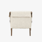 Four Hands Furniture brand Bauer chair in thames cream with stained wood legs and leather buckled straps on a white background