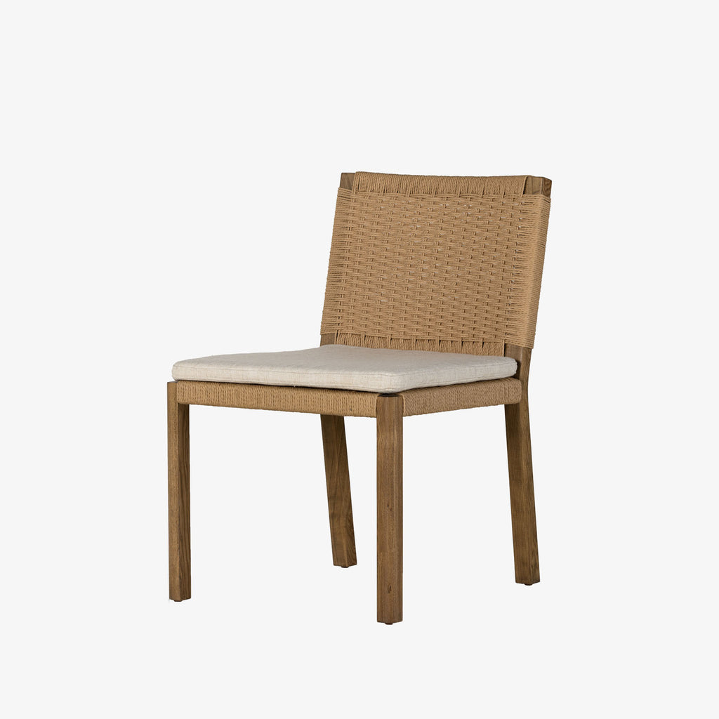Four Hands Zuma Dining Chair with beige cushion and woven back in Dune Ash on a white background