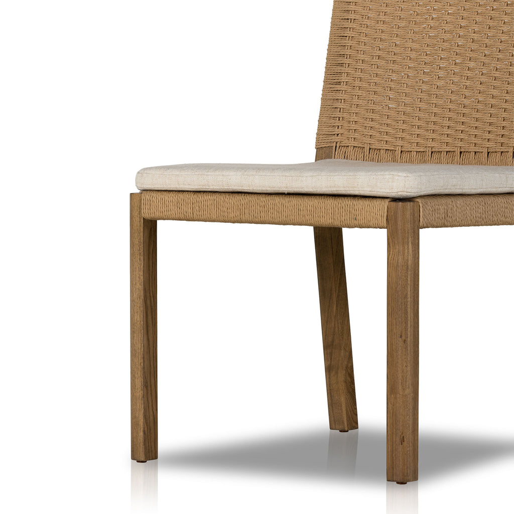 Four Hands Zuma Dining Chair with beige cushion and woven back in Dune Ash on a white background