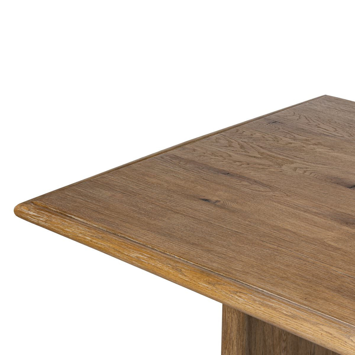 Close up of Four Hands 72" Glenview Dining Table in Weathered Oak Veneer on a white background at Addison West