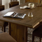 Close up of Four Hands 72" Glenview Dining Table in Weathered Oak Veneer in a dining room at Addison West