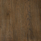 Close up of Four Hands 85.5" Glenview Dining Table in Weathered Oak Veneer on a white background at Addison West