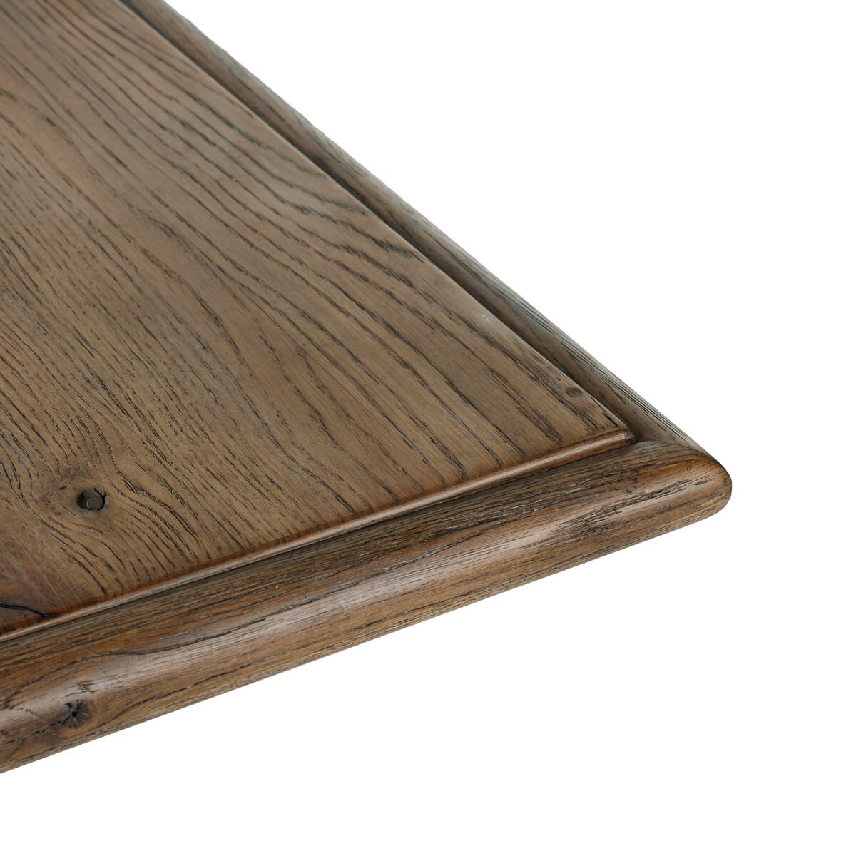 Close up of Four Hands 85.5" Glenview Dining Table in Weathered Oak Veneer on a white background at Addison West