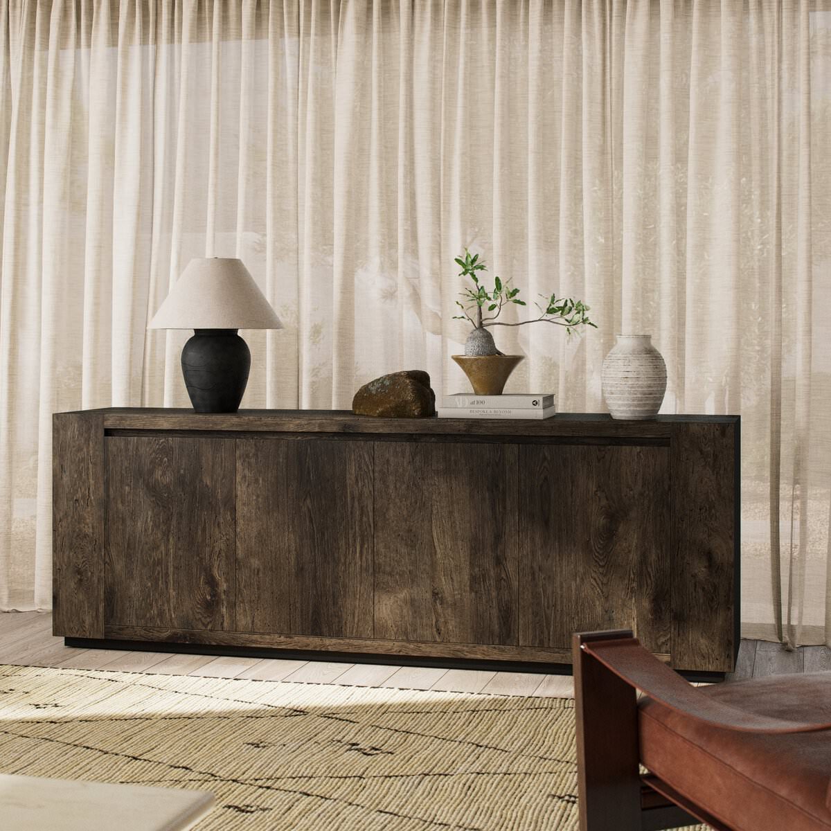 Four Hands Abaso Sideboard in Ebony Rustic Wormwood Oak in a living room at Addison West