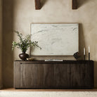 Four Hands Abaso Sideboard in Ebony Rustic Wormwood Oak in a living room at Addison West