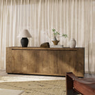 Four Hands Abaso Sideboard in Rustic Wormwood Oak in a living room at Addison West