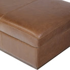 Close up of Four Hands Alec Storage Ottoman in Dulane Mahogany on a white background at Addison West
