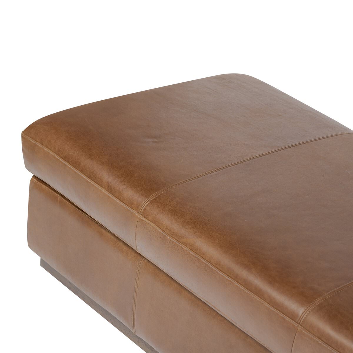 Close up of Four Hands Alec Storage Ottoman in Dulane Mahogany on a white background at Addison West