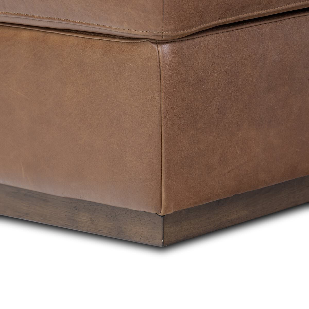 Close up of Four Hands Alec Storage Ottoman in Dulane Mahogany on a white background at Addison West