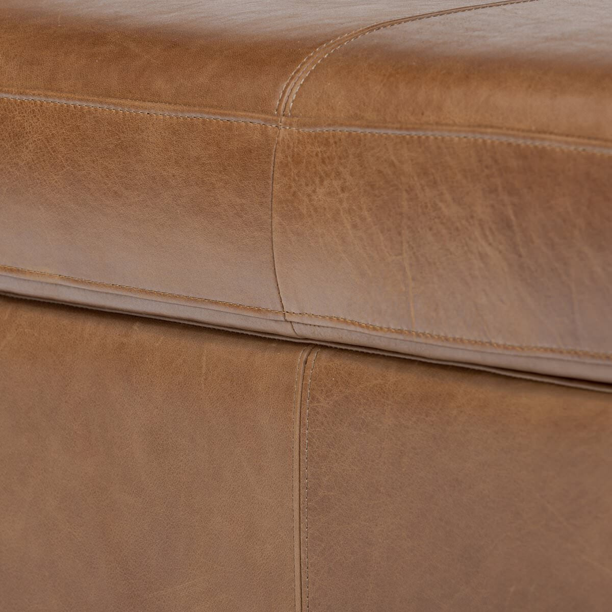 Close up of Four Hands Alec Storage Ottoman in Dulane Mahogany on a white background at Addison West