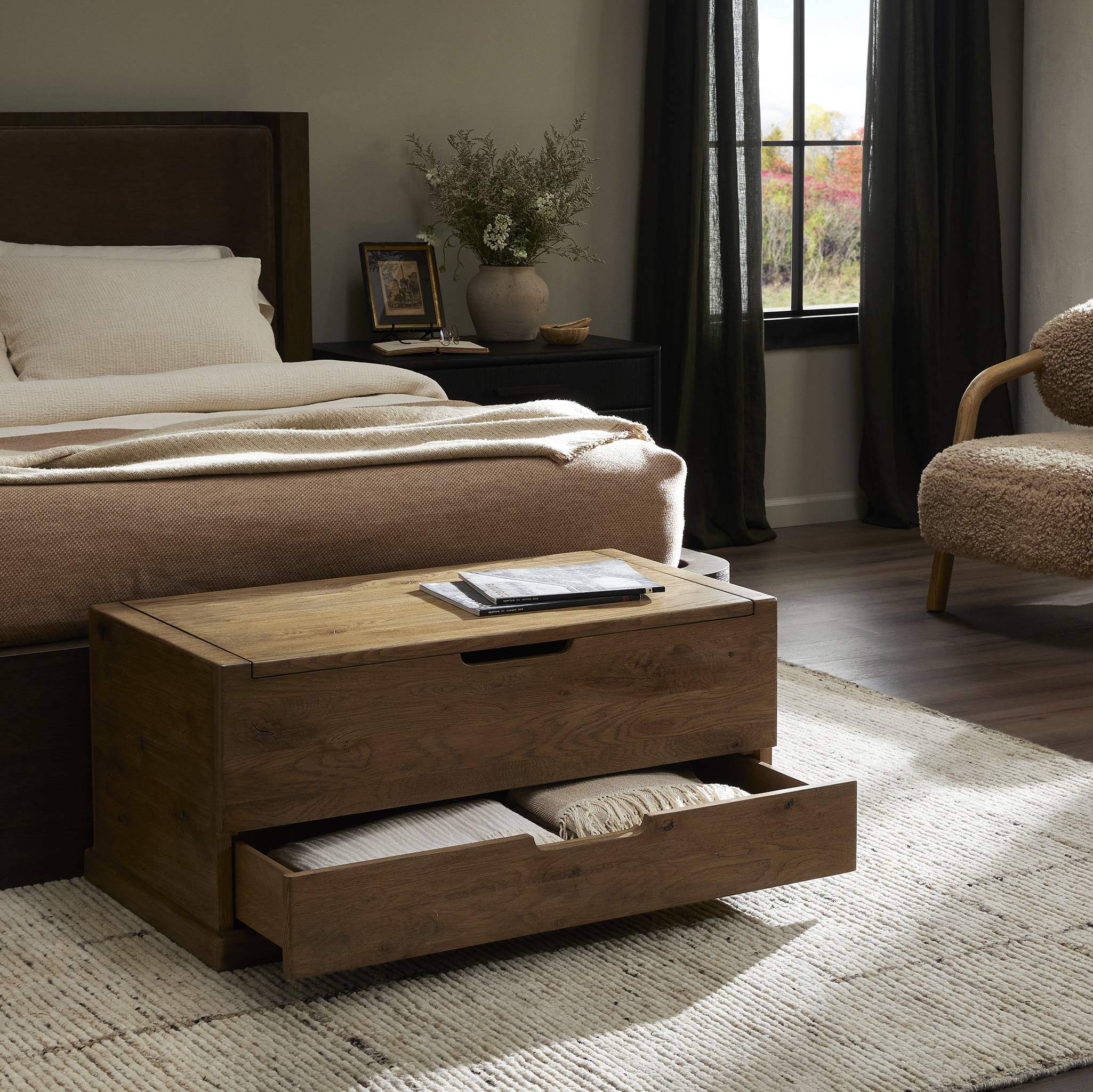Four Hands Arizona Trunk in Weathered Oak in a bedroom at Addison West