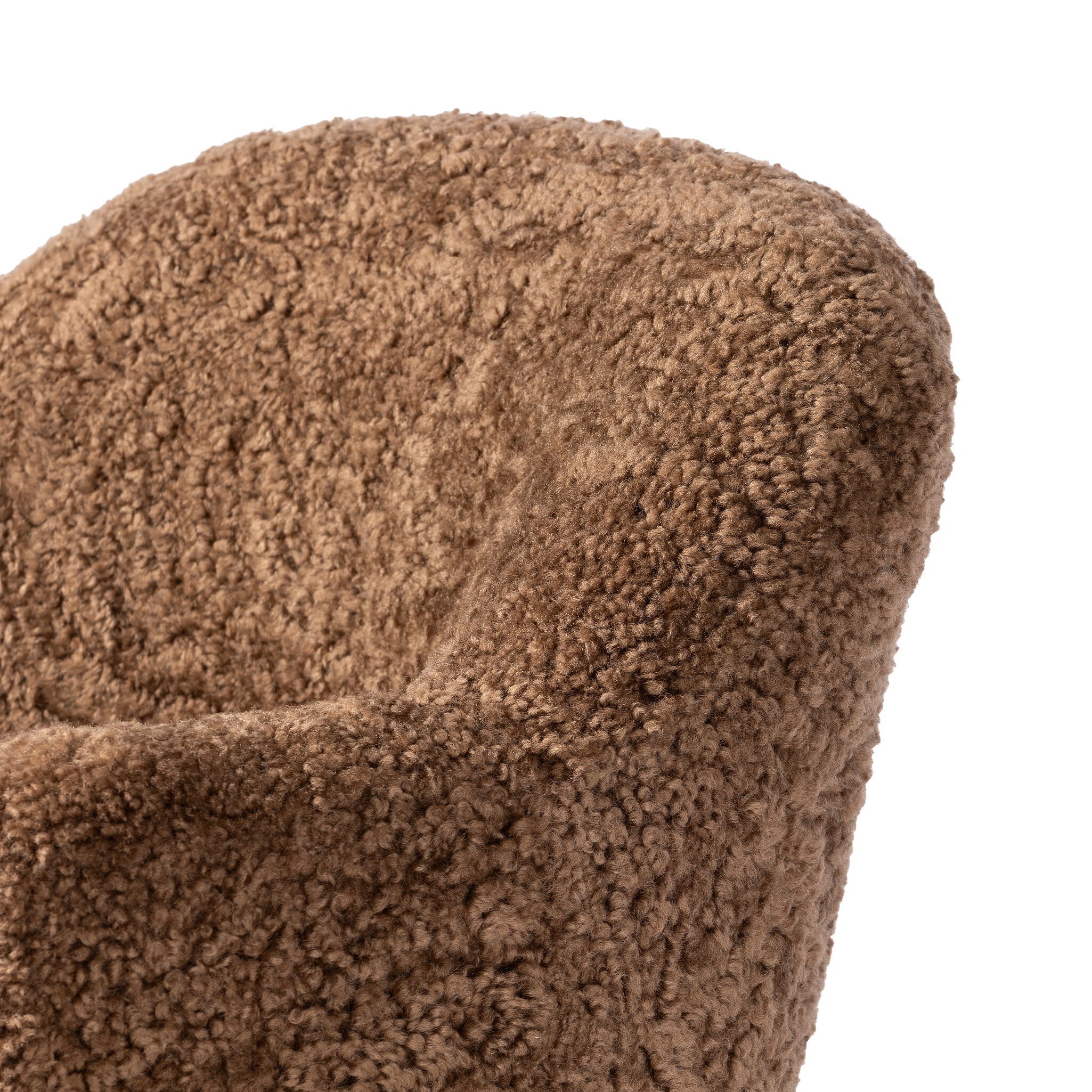 Four Hands Aurora Swivel Chair in Amber Shearling on a white background at Addison West