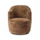 Four Hands Aurora Swivel Chair in Amber Shearling on a white background at Addison West