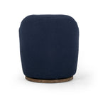 Back of Four Hands Aurora Swivel Chair in Copenhagen Indigo on a white background at Addison West