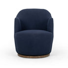 Four Hands Aurora Swivel Chair in Copenhagen Indigo on a white background at Addison West