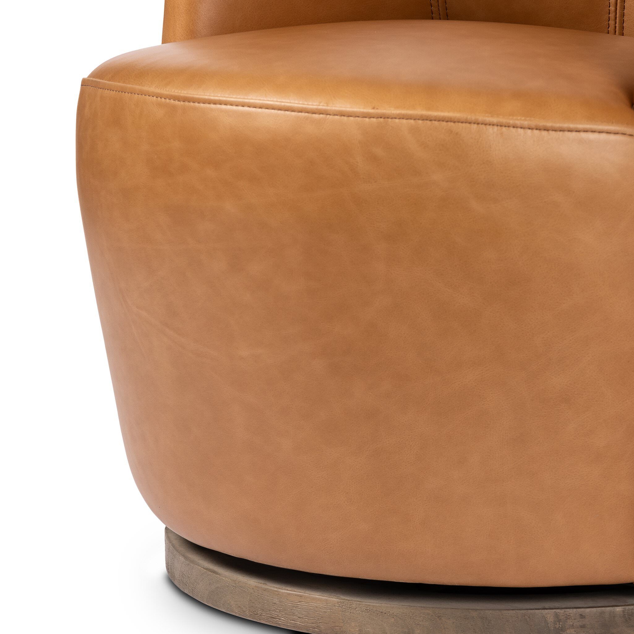 Close up of Four Hands Aurora Swivel Chair in Sonoma Butterscotch on a white background at Addison West