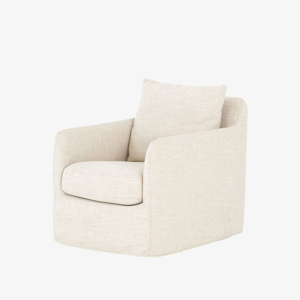 Four hands furniture brand Banks swivel chair with creme colors slip cover in cambric ivory on a white background