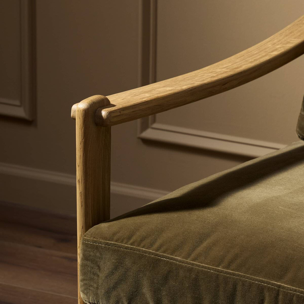 Close up of Four Hands Barwin Chair in Surrey Olive in a living room at Addison West
