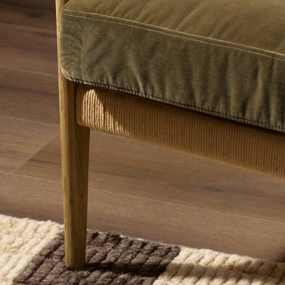 Close up of Four Hands Barwin Chair in Surrey Olive in a living room at Addison West